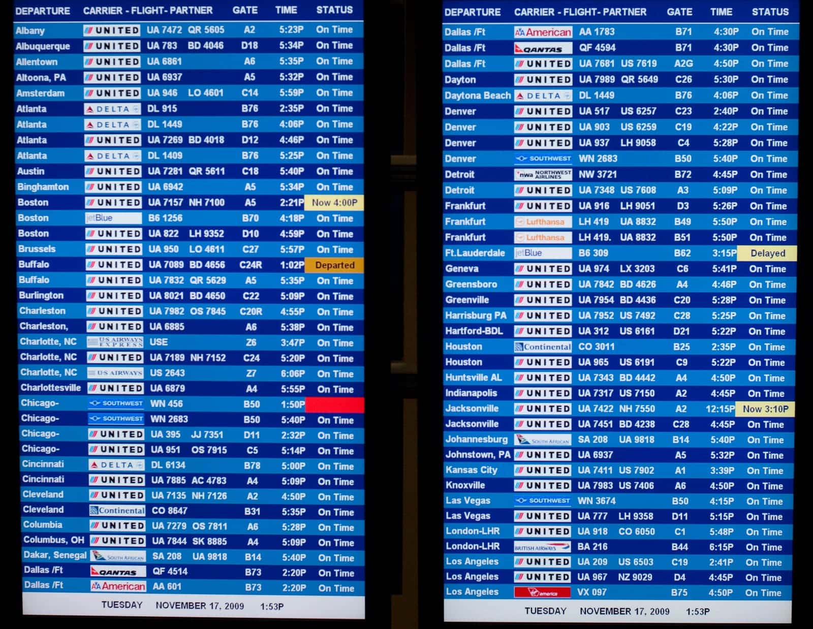 International departure and arrival board at Washington Dulles Airport showing flight times