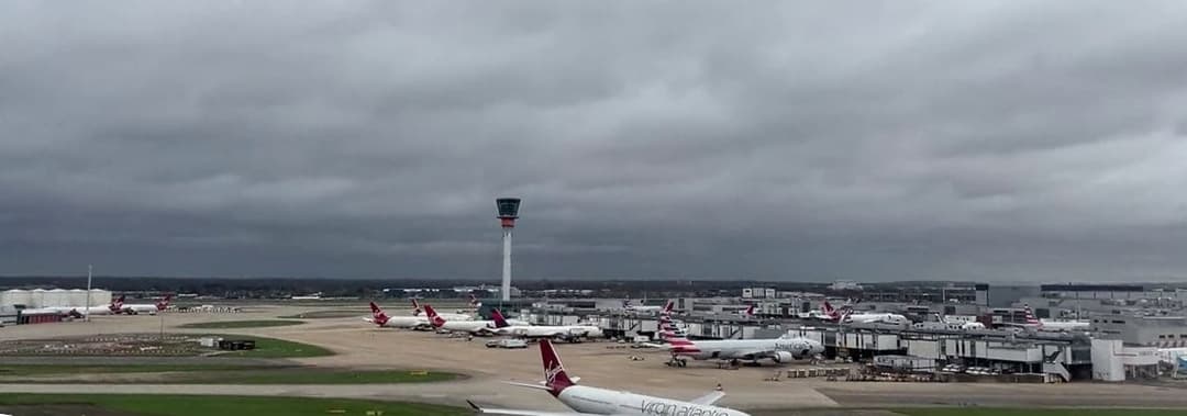 London Heathrow Terminal 3 and air traffic control tower, hub of the busiest USA-Europe route