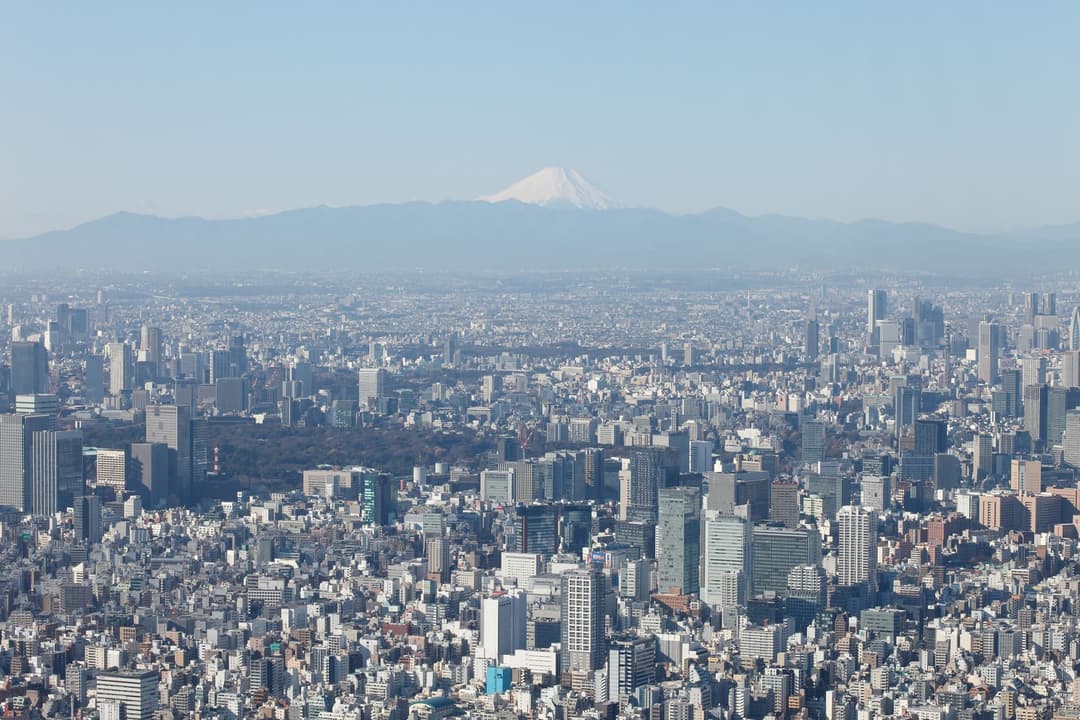 Mount Fuji visible above the Tokyo skyline as seen from Tokyo Skytree