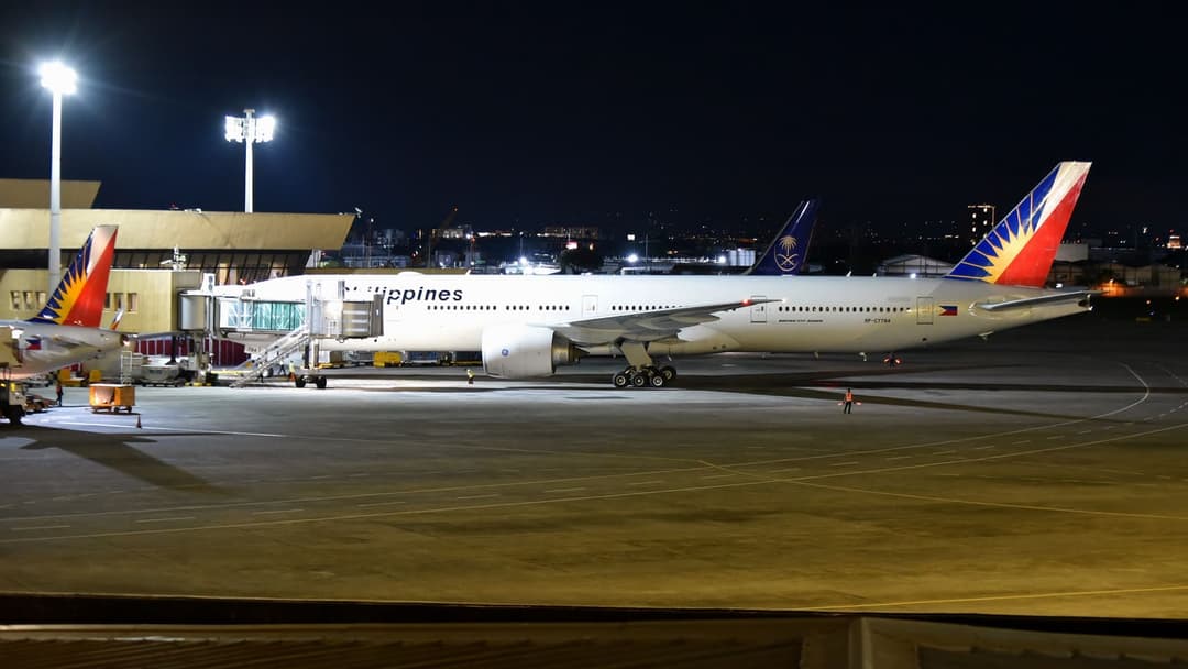 A Philippine Airlines Boeing 777 aircraft on the tarmac at Ninoy Aquino International Airport, Manila