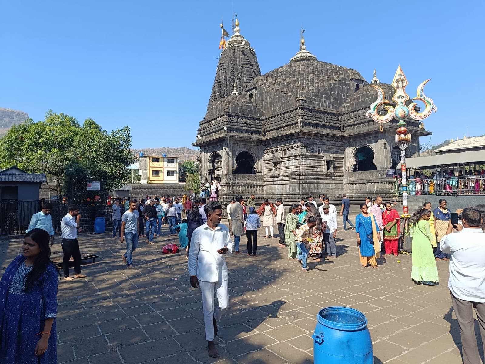 The black stone Trimbakeshwar Shiva Temple in Trimbak, near Nashik, under a cloudy sky