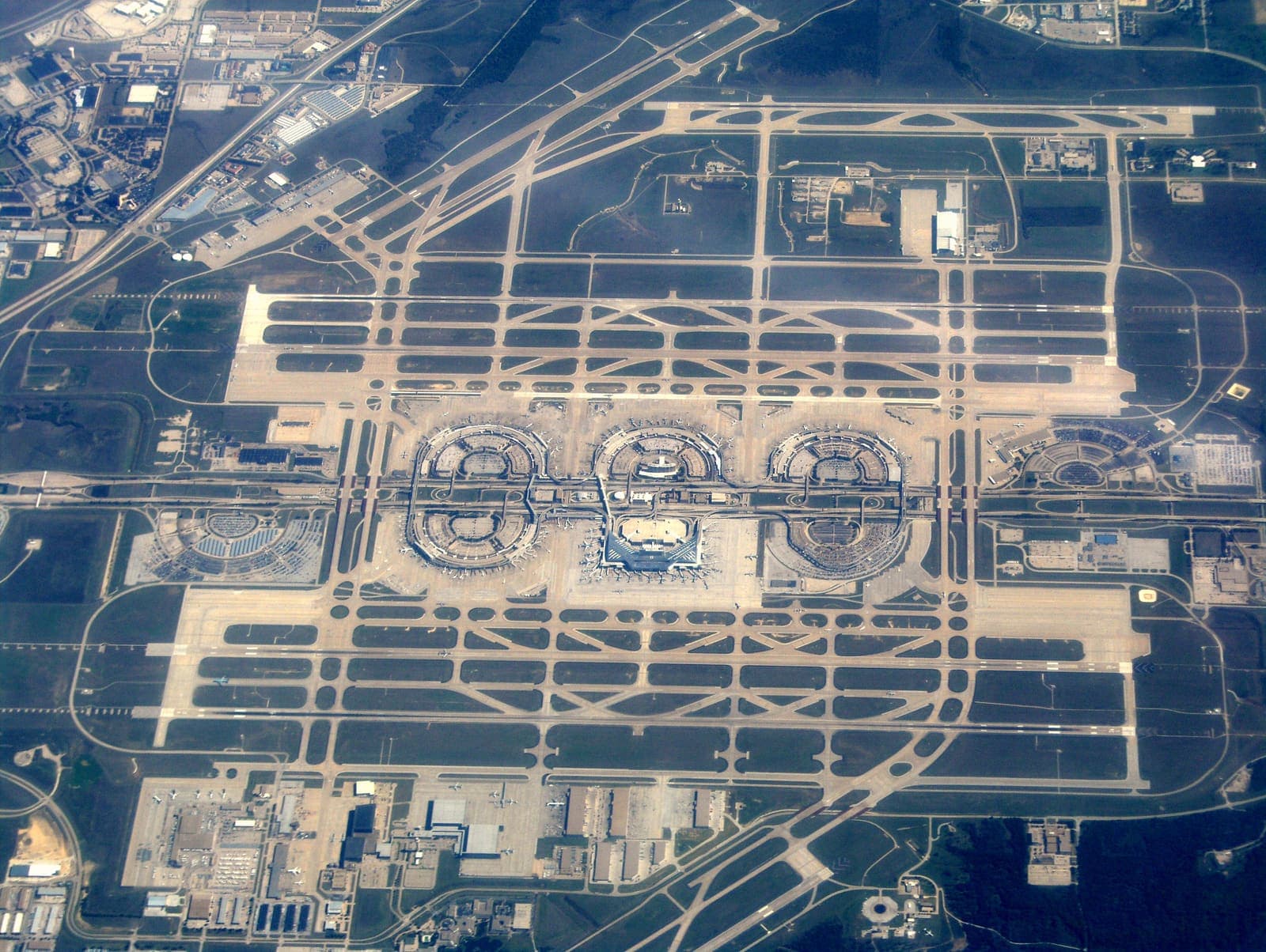 Aerial overview of Dallas-Fort Worth International Airport's terminal complex and runways