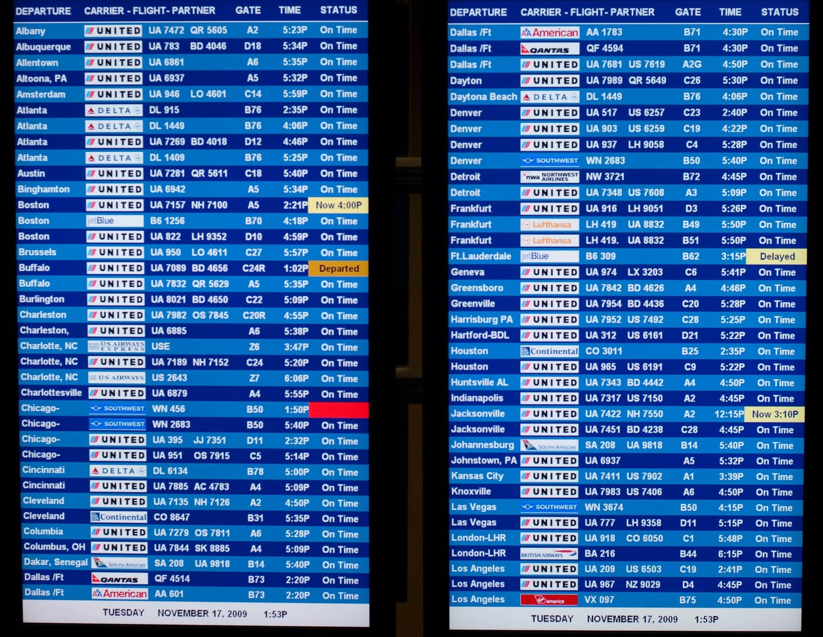 International departure and arrival board at Washington Dulles Airport showing flight times