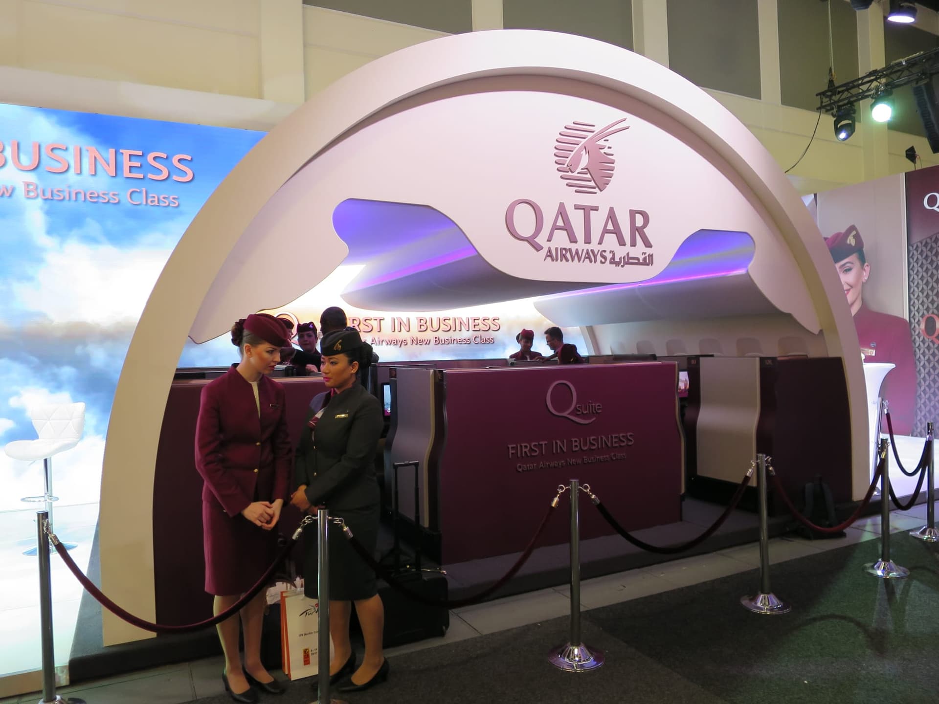 Qatar Airways Qsuite business class cabin with sliding privacy doors, the airline's flagship business product on select India-bound aircraft
